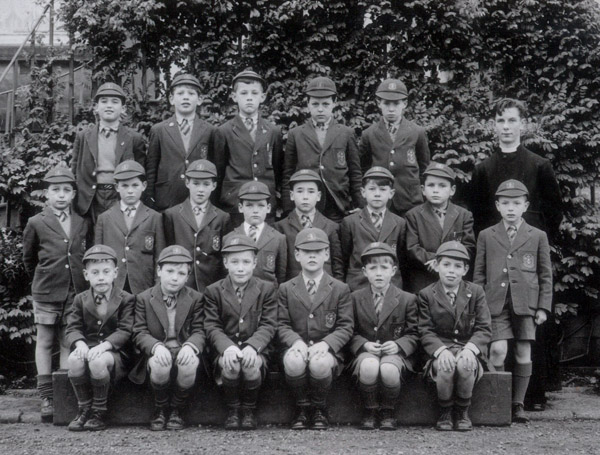 Class Photo 1956.jpg - Class C taken probably at Easter, 1956. Included in the photo Jacek Holdanowicz.Back row: Kenneth O'Hara, Alexander Channing-Pierce, Jacek Hołdanowicz, Glen Ross, N/KMiddle row: Lorenzo Pelosi, Alan Murray, Neil Allen, ?Martin?, N/K, Kim Fox, Michael Somerville, Stanisław (Stanislas) UrbaniakFront row: Alan Alcock, N/K, Damien Delucca, Mark Horne, John Henderson, Michael ClarkeOur form master at the right is Bro. Lémon 